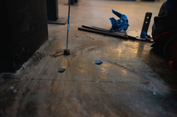 Flush anchor points drilled into the concrete slab