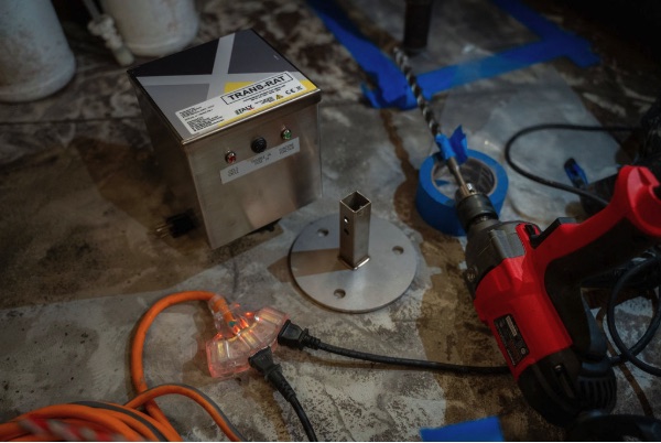 TRANSRAT unit staged on a prepped slab with install tooling