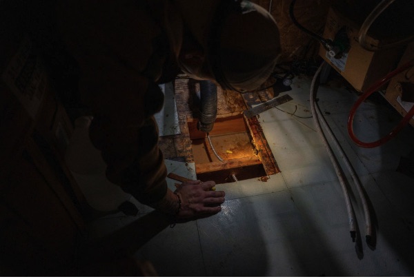 Crawl-space inspection through a floor hatch